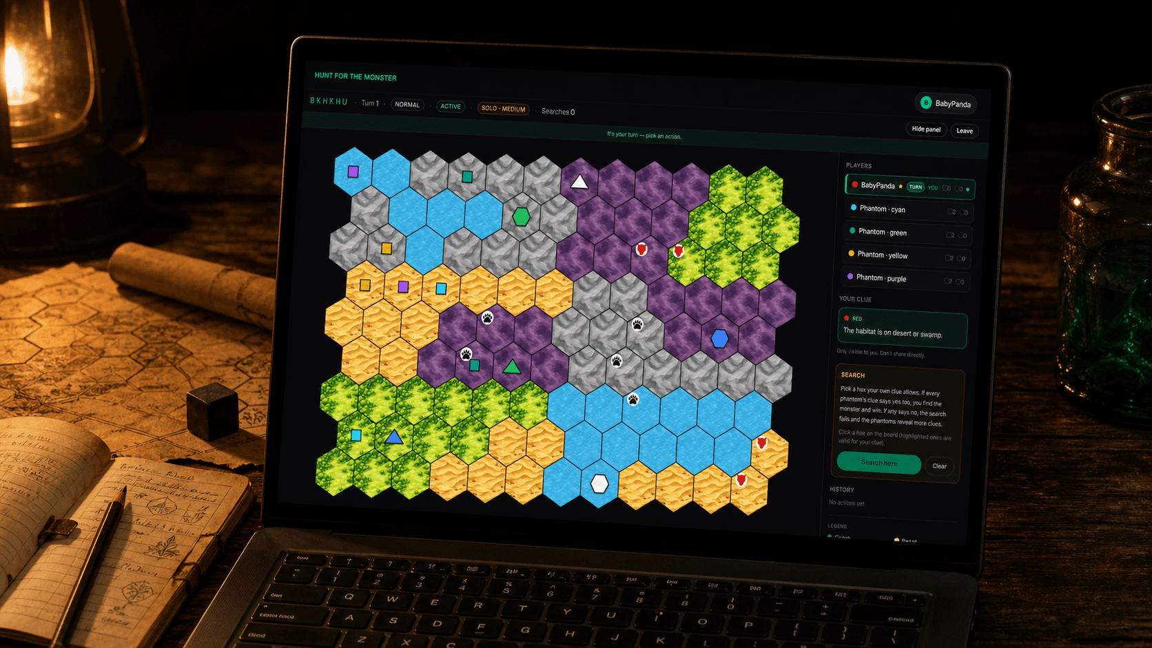 An editorial product photograph of the Hunt For The Monster game running on a matte-black laptop on a dark walnut table, warm lantern light raking across the keyboard and bezel, an open leather notebook and rolled parchment to the left and a green-glass jar to the right.